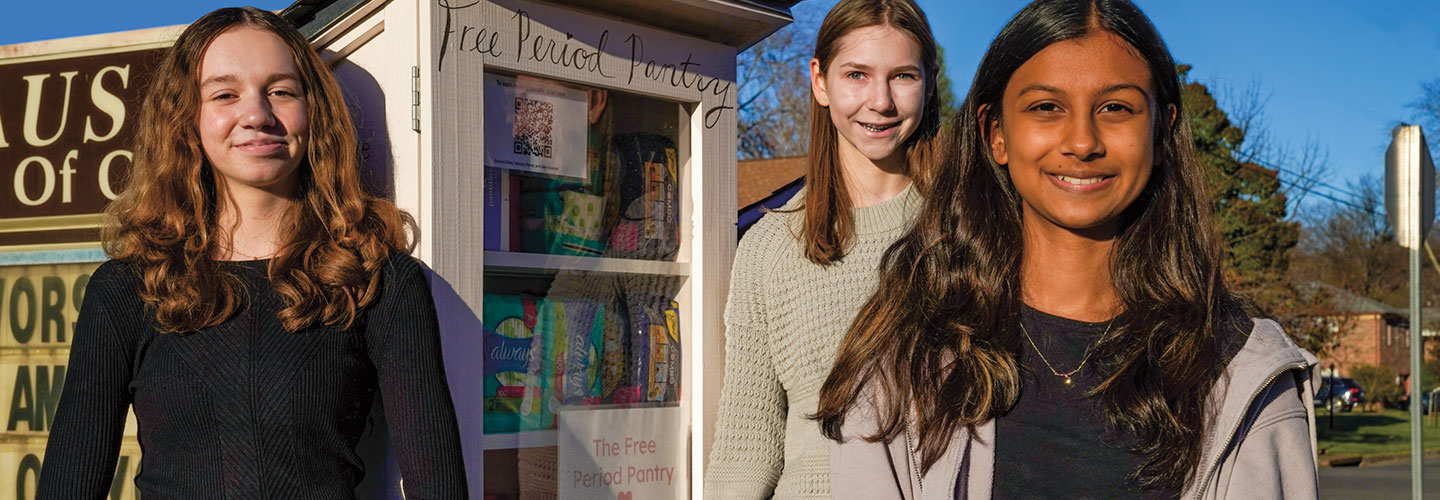 Image of three students advertising the "Period Pantry"