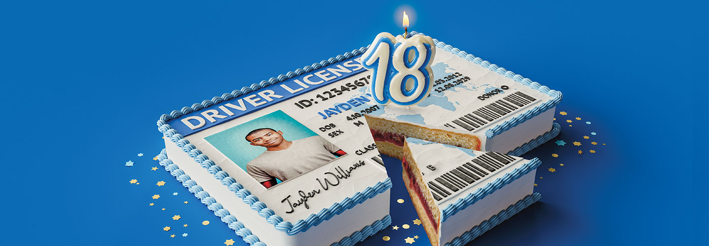 Image of a driver&apos;s licensce cake with number 18 candles on top