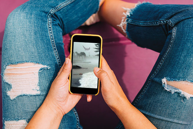 A cellphone in someone&apos;s lap